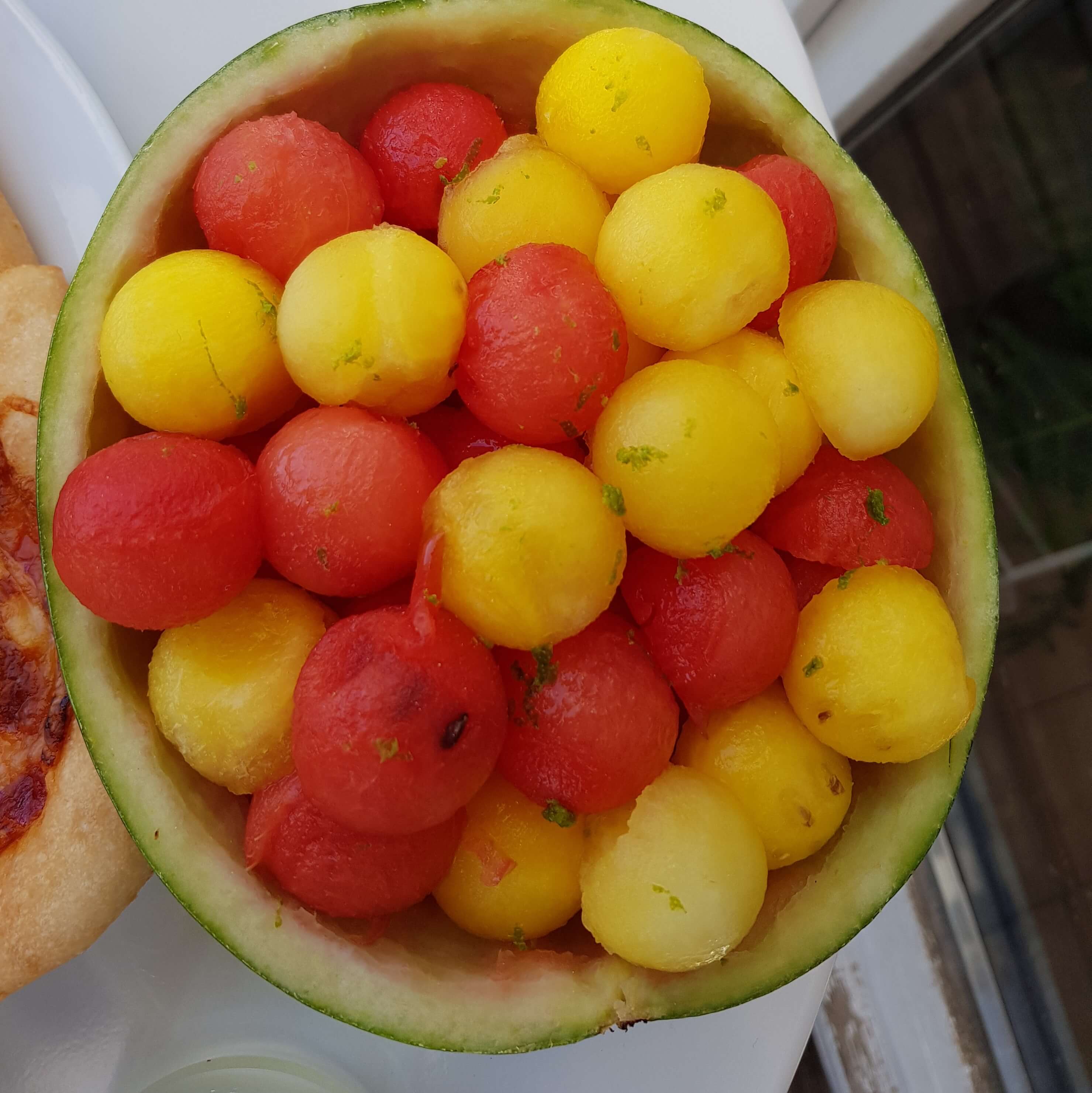 Watermelon balls salad in a watermelon bowl